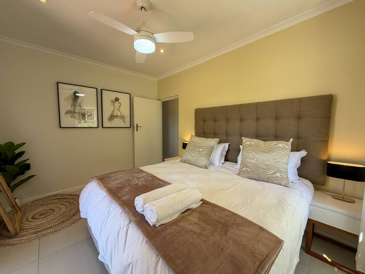 Main bedroom with an upholstered headboard