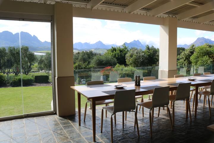 Du Vin restaurant interior with a long table and mountain views