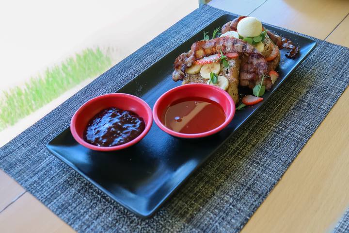 A breakfast platter on a black slate