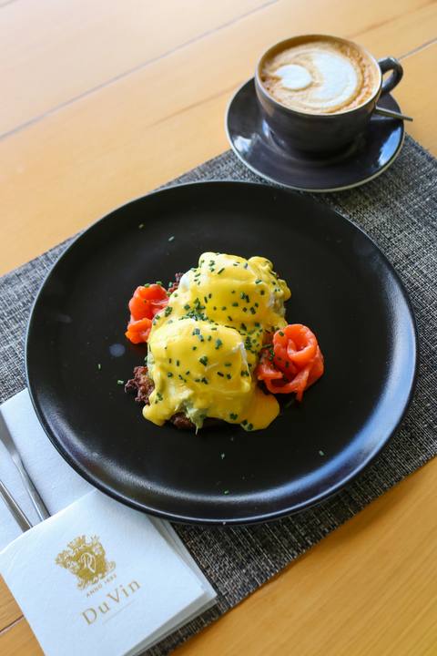 A plated breakfast with a coffee