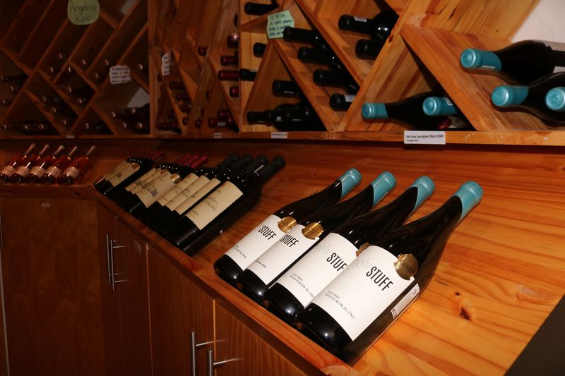 Bottles laid out on the timber display shelves