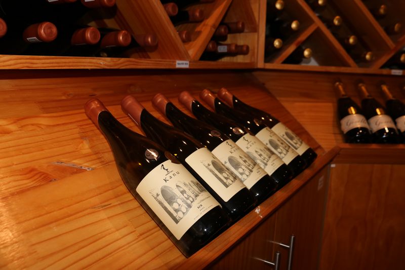 Close-up of Kanu bottles on the display shelves