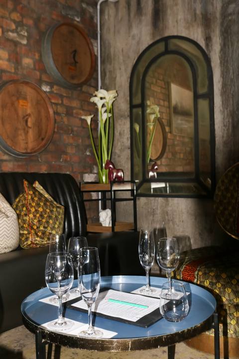 Tasting table with glasses and fresh flowers